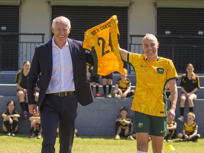 Matildas Midfielder Tameka Yallop with Experience Gold Coast CEO John Warn  and young players at TamekaÃs junior club, Mudgeeraba Soccer Club. Picture: Glenn Campbell