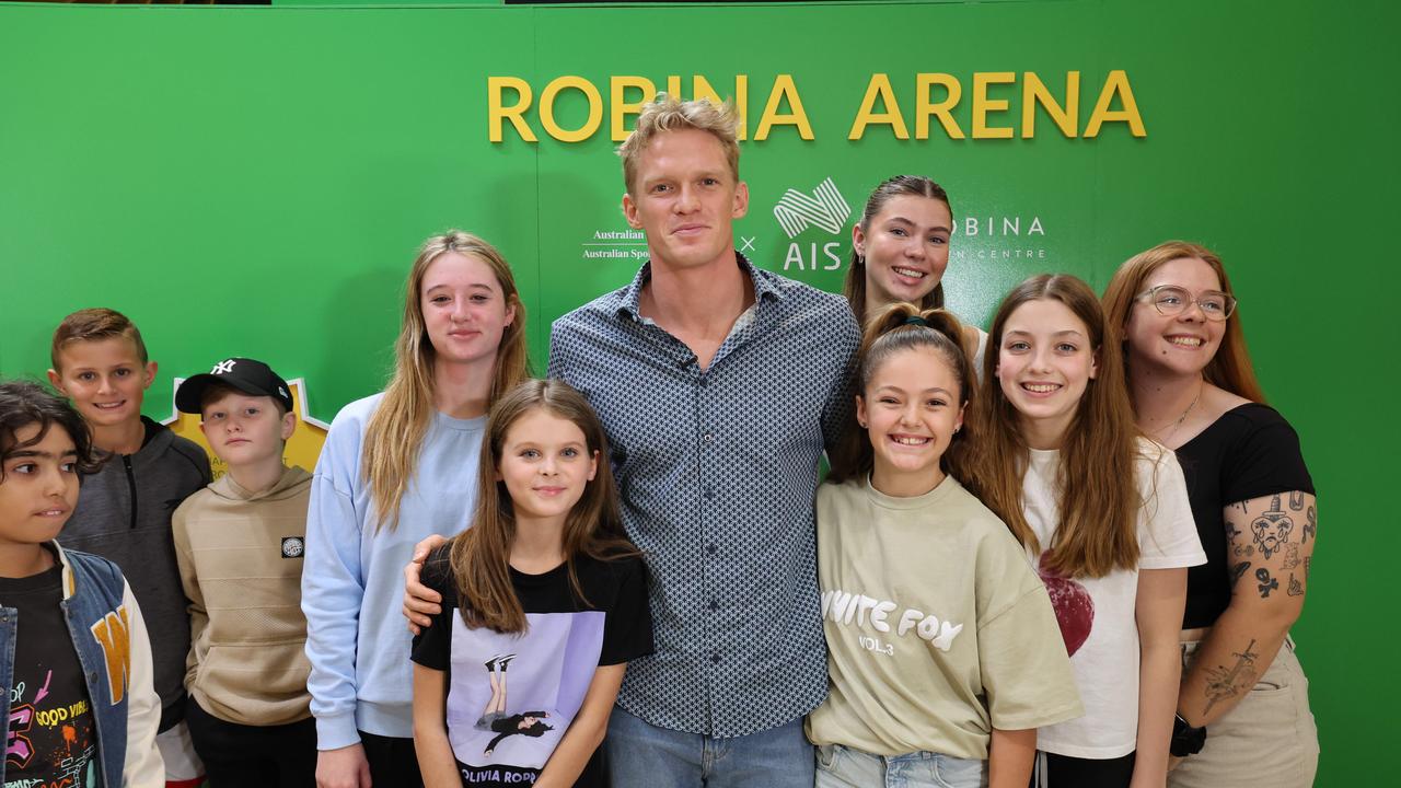 Fans pose for a photo with Cody Simpson at a meet-and-greet at Robina Town Centre outside Myer . Picture Glenn Hampson