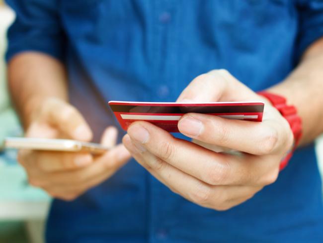 A man using a credit card online while shopping on his smartphone. Picture: iStock.