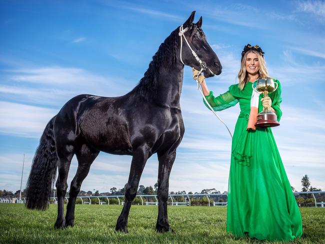 Flemington ambassador Georgia Connolly with 2018 Lexus Melbourne Cup. Picture: Jake Nowakowski