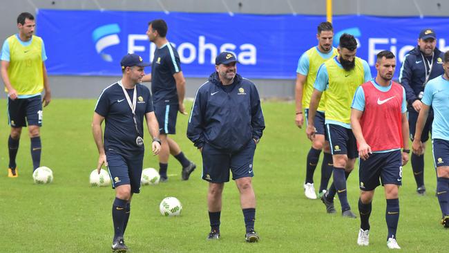 Australia head coach, Ange Postecoglou (C).