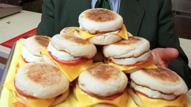 **FILE**Herb Peterson, the creator of the Egg McMuffin, shows off his invention in this April 1997 file photo, at one of his McDonald's franchises in Santa Barbara, Calif. Peterson, 89, died in Santa Barbara on Tuesday. (AP Photo/John Hayes/file)