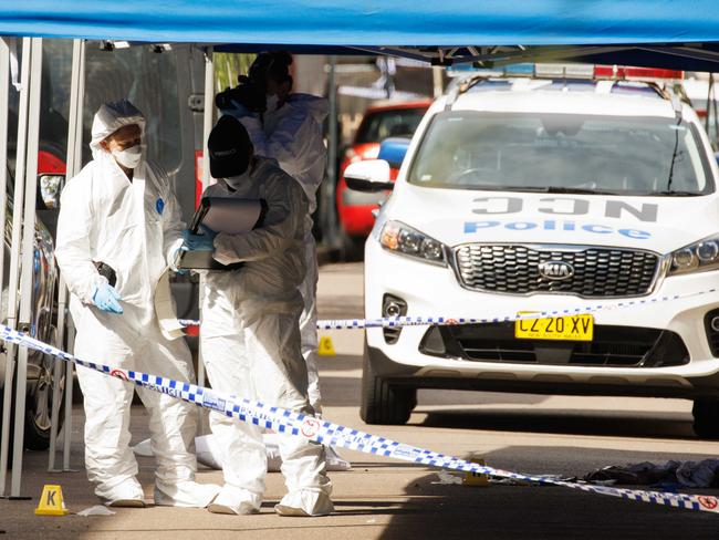 Police investigating the scene where a knife-wielding man was shot dead. Picture: David Swift.