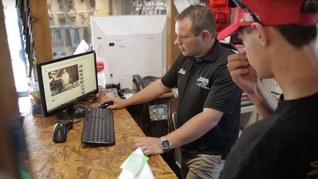 James Kilpatrick on the computer at his shop in Newcastle.