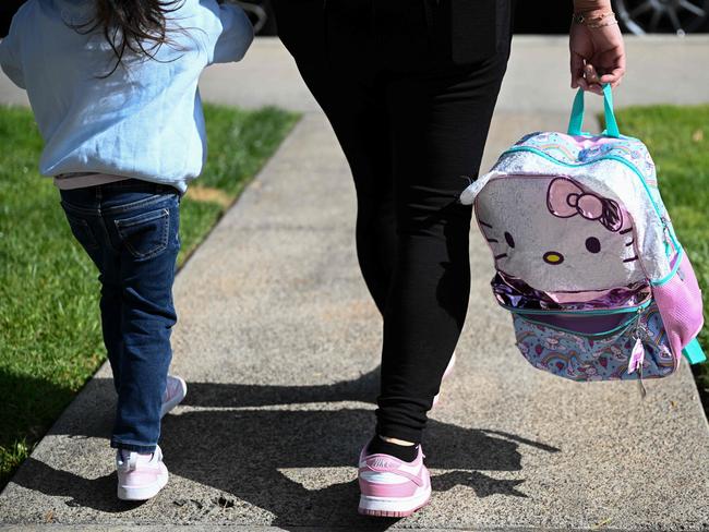An undocumented immigrant mother from Mexico walks with her young daughter, who is a US citizen, as they go to daycare from their home in San Diego, California. Picture: AFP
