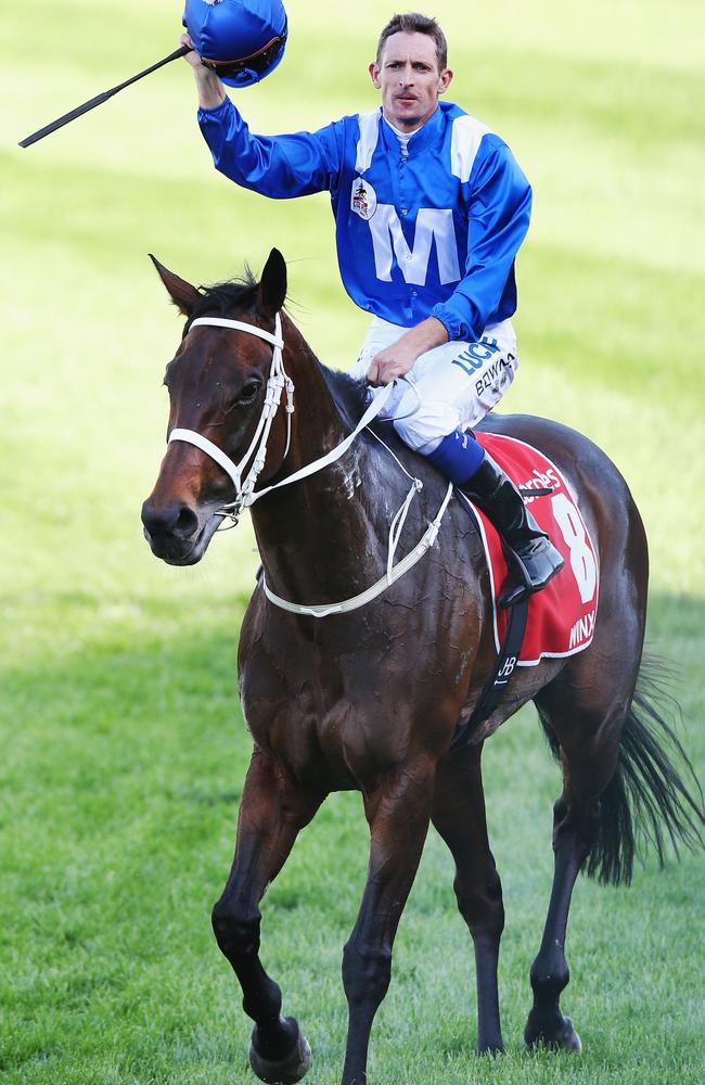 Hugh Bowman acknowledges the adoring crowd after the mighty mare’s brave win. Picture: Getty Images