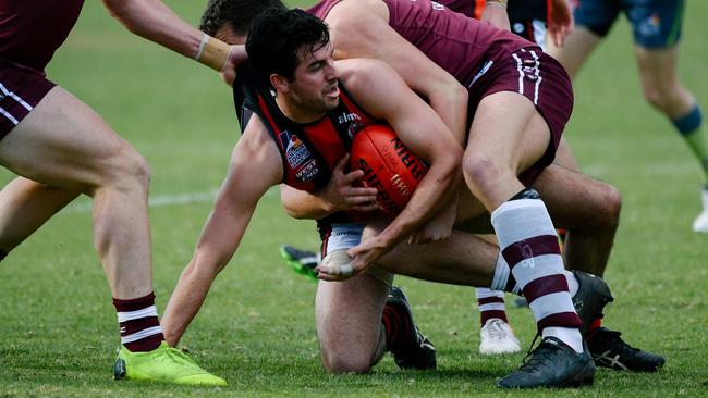 Kieran Holland with the ball on the ground during the Adelaide Footy League match between Prince Alfred Old Collegians and Rostrevor Old Collegians on Saturday, June 22, 2019. (AAP Image/ Morgan Sette)