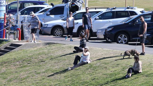 People at Bar Beach on Friday. Picture: NCA NewsWire / Peter Lorimer.