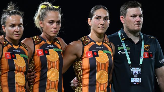 CAIRNS, AUSTRALIA - OCTOBER 24: Daniel Webster, Senior Coach of the Hawks, lines up with players before the round nine AFLW match between Hawthorn Hawks and Narrm (Melbourne Demons) at Cazaly's Stadium, on October 24, 2024, in Cairns, Australia. (Photo by Albert Perez/AFL Photos via Getty Images)