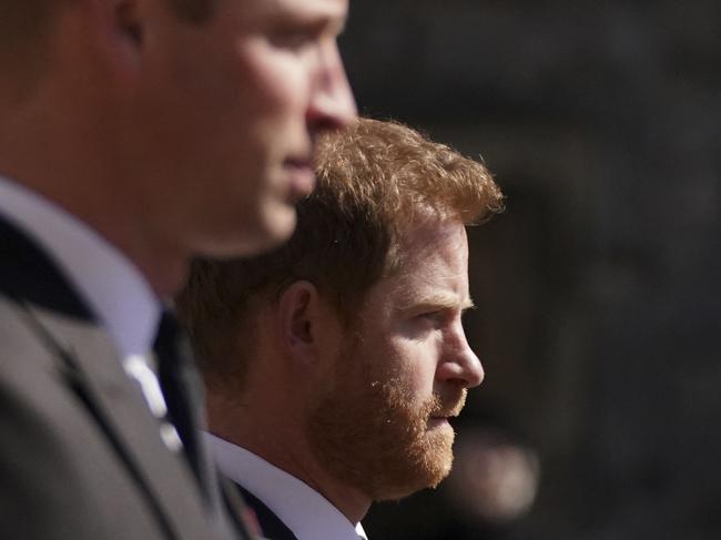 ALTERNATIVE CROP VERSION - Britain's Prince William, Duke of Cambridge, Peter Phillips and Britain's Prince Harry, Duke of Sussex walk during the funeral procession of Britain's Prince Philip, Duke of Edinburgh to St George's Chapel in Windsor Castle in Windsor, west of London, on April 17, 2021. - Philip, who was married to Queen Elizabeth II for 73 years, died on April 9 aged 99 just weeks after a month-long stay in hospital for treatment to a heart condition and an infection. (Photo by Victoria Jones / POOL / AFP) / ALTERNATIVE CROP VERSION