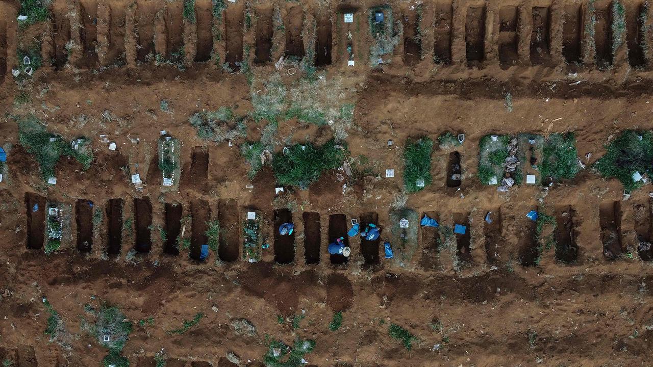 Aerial view of gravediggers working during the new coronavirus COVID-19 pandemic at the Vila Formosa Cemetery, in the outskirts of Sao Paulo, Brazil. Picture: AFP