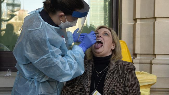 Liberal MP Wendy Lovell receives a rapid Covid test on the steps of parliament. Picture: NCA NewsWire/Andrew Henshaw