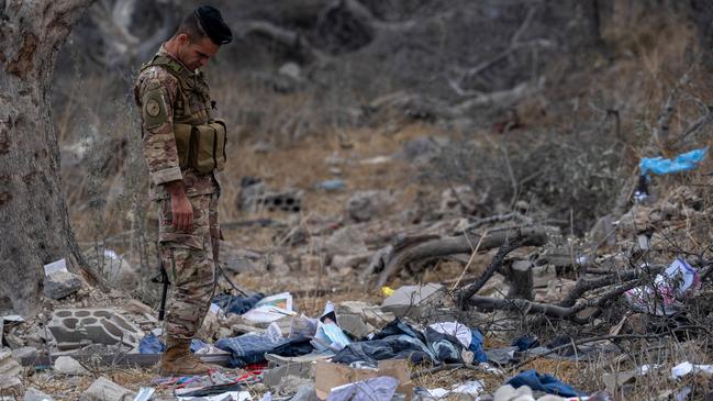 A soldier stands among debris from a destroyed house. Picture: Carl Court/Getty Images