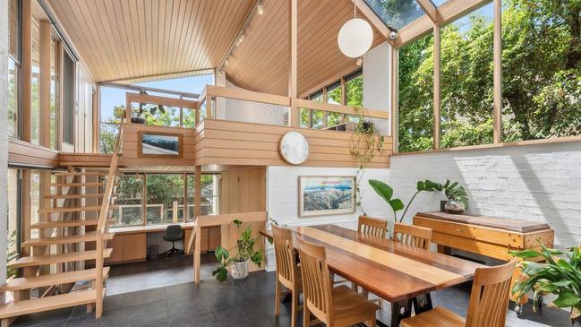 A mezzanine level above the study, laundry and sauna offers an additional sitting area.