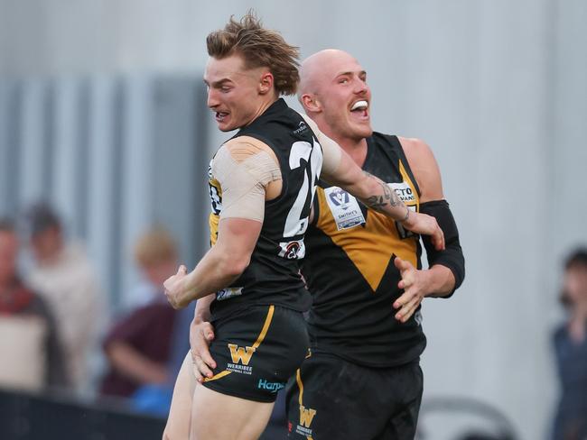 Jay Dahlhaus (left) celebrates a goal in the grand final last year. Picture: Rob Lawson/AFL Photos via Getty Images