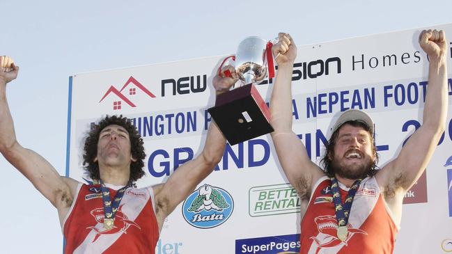 Schwarze and Lawson raise the 2008 silverware.