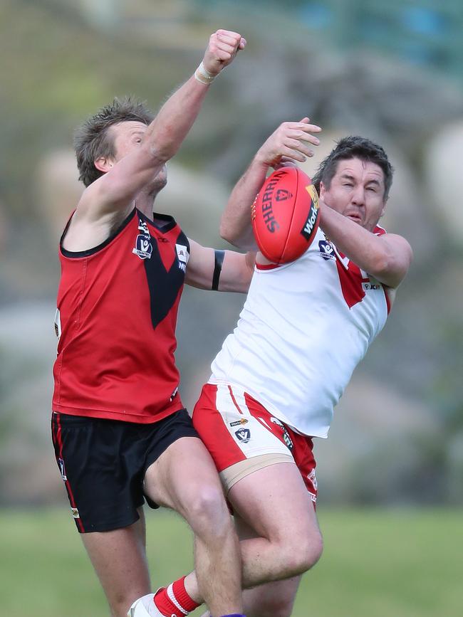 Stawell’s Thomas Eckel spoils Ararat’s Jake Williamson.