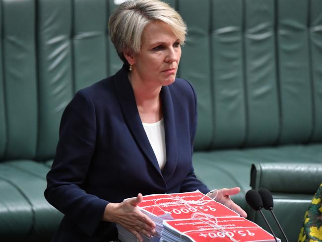 Member for Sydney Tanya Plibersek submits a petition from the March 4 Justice rally during Question Time at Parliament House on Tuesday. Picture: Getty Images