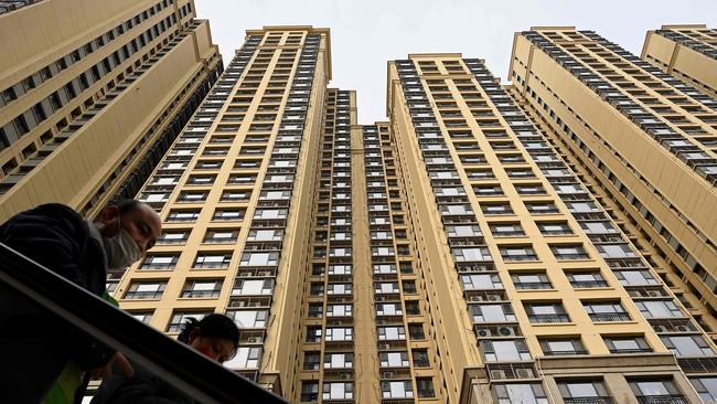 Potential homebuyers inspect an Evergrande housing complex. Picture: AFP