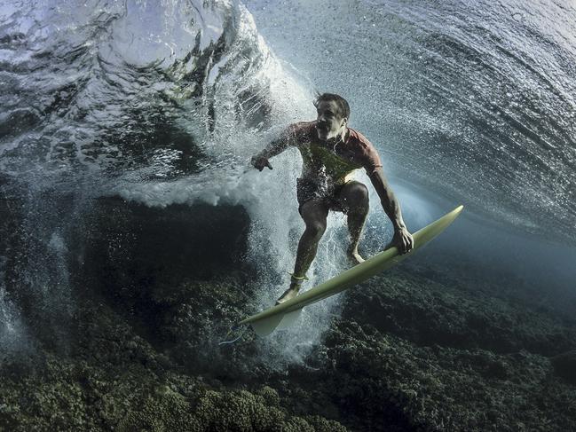 Under The Wave I recently traveled to Tavarua, Fiji to do some surf photography with pro surfer Donavon Frankenreiter at Cloudbreak. I&#39;m always looking for new angles and perspectives. The usual surf shots have all been done so we decided to get a little creative. Makes you look twice. Picture: Rodney Bursiel / National Geographic Travel Photographer of the Year