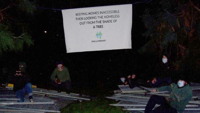 Members of Grassroots Action Network Tasmania dismantled a hundred metres of steel fencing around the giant trees in St David's Park in solidarity with community members sleeping rough. Picture: Grassroots Action Network Tasmania