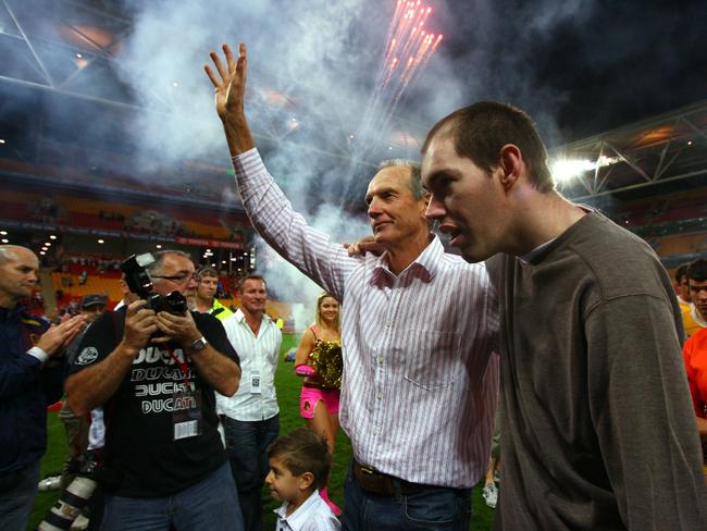 Coach Wayne Bennett, with his son Justin, is farewelled from the Broncos home ground for the last time in 2008.