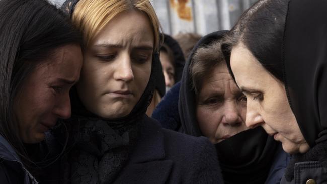 Family members react during a joint funeral at 'Saint's Peter and Paul Garrison Church', for two soldiers who died in the east of the country during recent fighting. Picture: Dan Kitwood/Getty Images