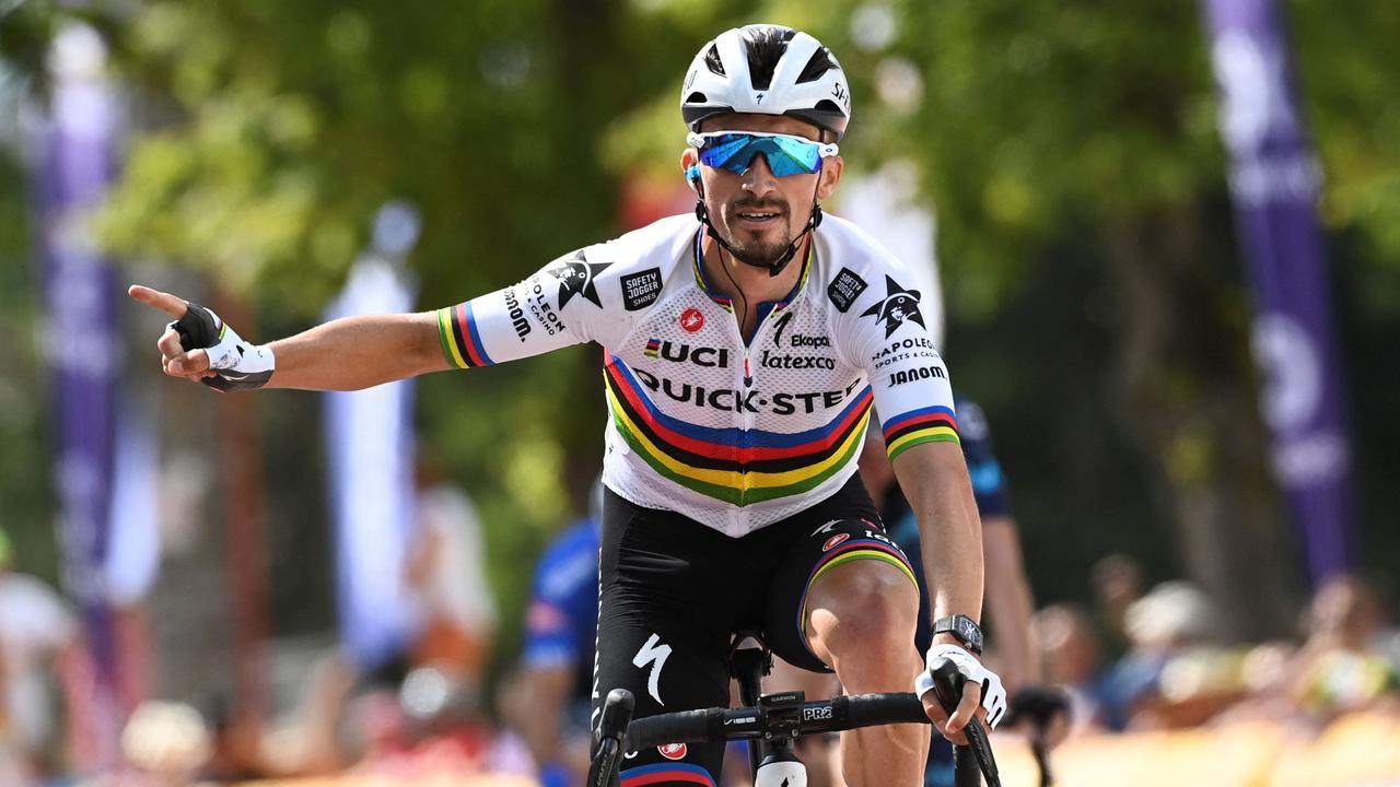 (FILES) In this file photo taken in Huy on July 23, 2022 shows French cyclist Julian Alaphilippe celebrating as he crosses the finish line to win the first stage of the Tour De Wallonie cycling race. - Title holder Alaphilippe will spearhead the French team at the road cycling world championships in Australia, French team manager Thomas Voeckler announced on September 13, 2022. (Photo by JOHN THYS / BELGA / AFP) / Belgium OUT