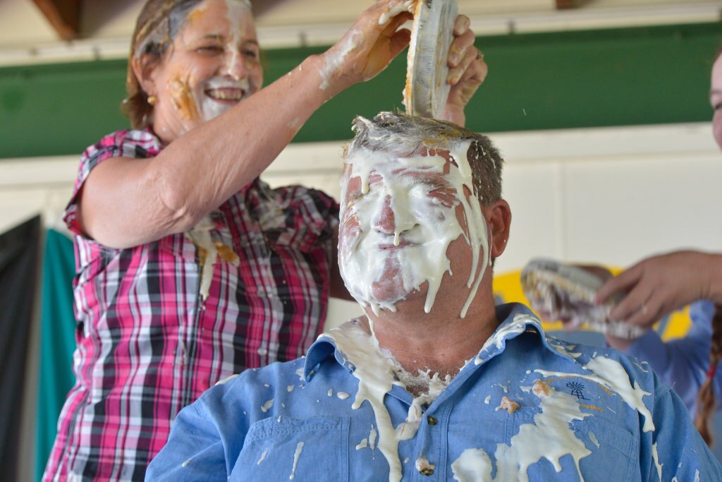 Principal Pauline Porch and teacher Norm Horan.PIE IN THE FACE - Mt Larcom State School raises money for drought relief. Picture: Mike Richards GLA140918PIEF