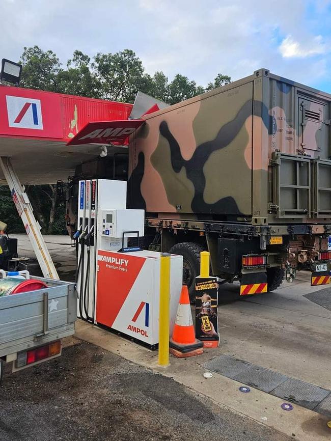 A military vehicle has damaged an Ampol service station in Sarina, Queensland. Picture: Facebook