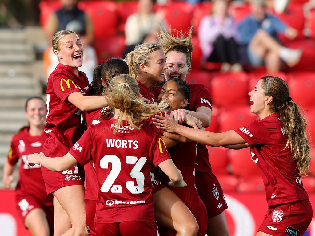 Adelaide United celebrate the winner. Photo: Sarah Reed/Getty Images.