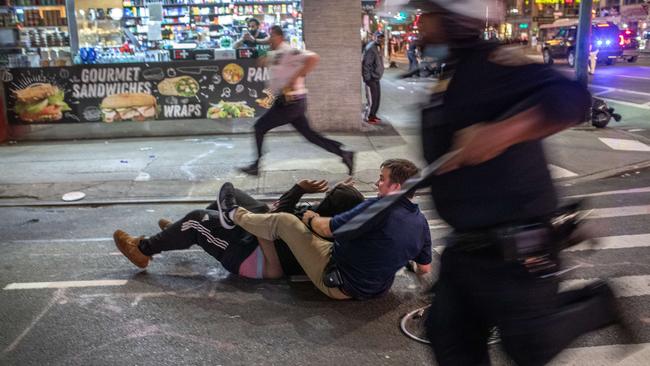 Police arrest a protester near Times Square after an 11pm curfew. Picture: AFP