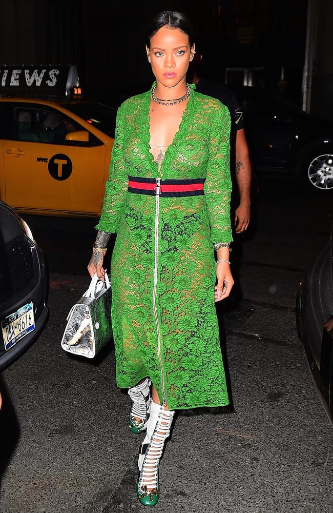 Rihanna was spotted out in NYC on Wednesday night, wearing a $3500 Gucci SS16 Green Lace Dress. She left her bra at home, showing off her perfect figure , and her nipples , as she headed to the Edition Hotel. She finished her look with Gucci Boots, and her hair pulled back in a bun. She strutted confidently for the cameras , as a Taxi drove behind her, with an ad for Rumored flame, Drake's new album, 