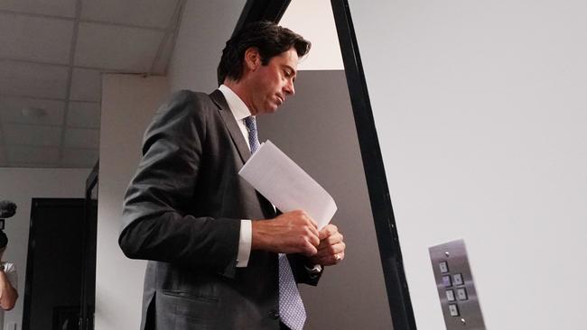 AFL CEO Gillon McLachlan leaves a press conference. Picture: AFP.