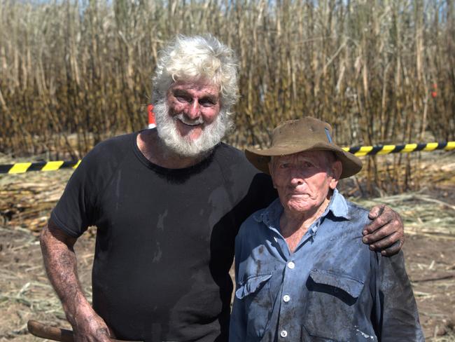 Jeffrey Bradshaw from Mackay, a five times cane cutting champion, with 90-year-old cane cutter Olivio Pozzebon. Mr Bradshaw came third in the 55 years+ category, cutting four drills of cane (each 15 metres long) in 19 minutes, 10 seconds.