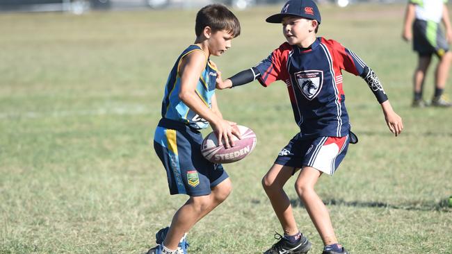Coomera's Hayden Watson playing in an U10 touch football competition.