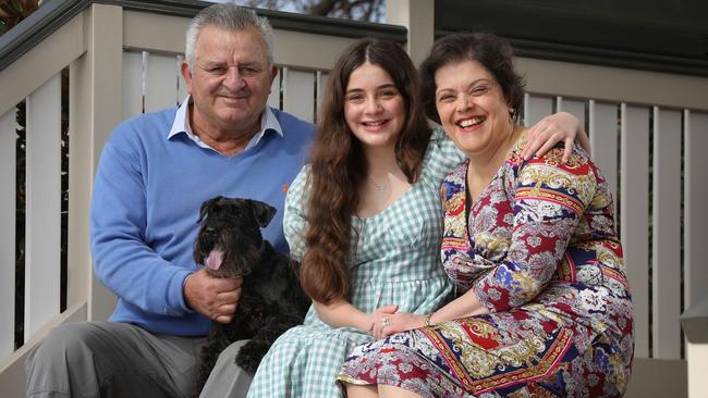 Sue Tselikidis at home in Semaphore with her 12-year-old daughter Stavroula, husband Lucky, and dog Shorty. Picture: Dean Martin / The Advertiser