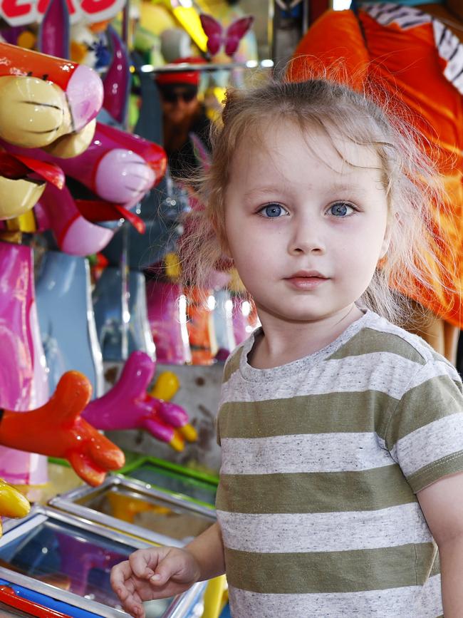 Maxwell Fordham plays the new sideshow alley clown game on the first day of the 2023 Cairns Show, held at Cairns Showgrounds. Picture: Brendan Radke