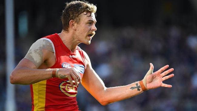 PERTH, AUSTRALIA - JUNE 12: Hugh Greenwood of the Suns kicks the ball during the 2021 AFL Round 13 match between the Fremantle Dockers and the Gold Coast Suns at Optus Stadium on June 12, 2021 in Perth, Australia. (Photo by Daniel Carson/AFL Photos via Getty Images)