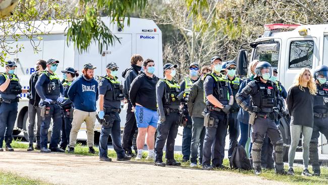 Police arrest protesters at Albert Park. Picture: Jake Nowakowski