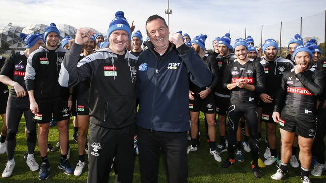 Neale Daniher with Collingwood coach Nathan Buckley and Magpies players ahead of the Queen’s Birthday clash. Picture: David Caird