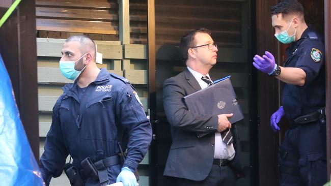 Police at one of the homes raided. Picture: John Grainger