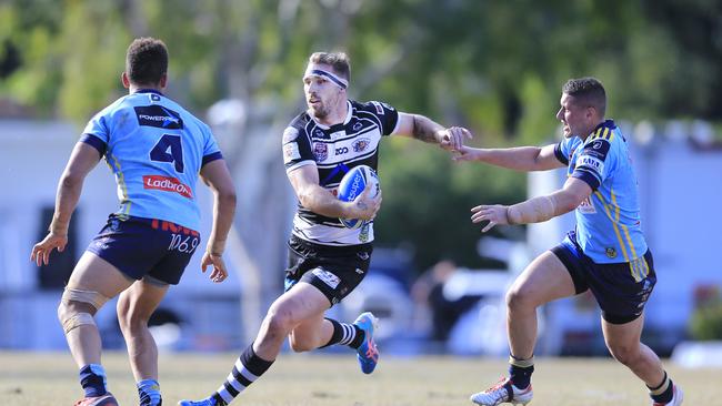 Bryce Cartwright (C) playing for the Tweed Heads Seagulls against the Norths Devils. Picture: SMP Images