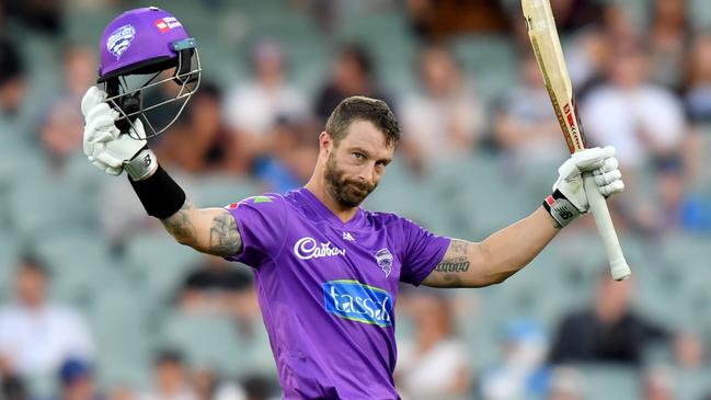 Matthew Wade raises his arms after reaching his century against Adelaide. Picture: AAP Image/Sam Wundke