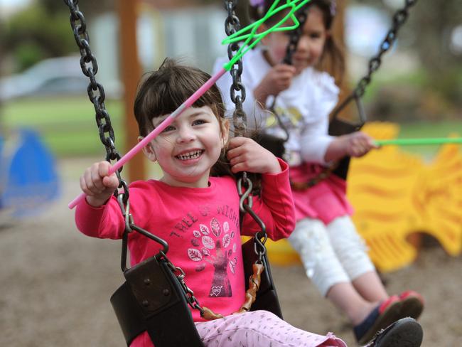 Chloe,3, and Hannah, 3, enjoy the playground at Logan Reserve.