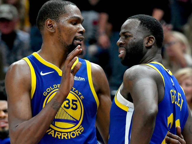 (FILES) In this file photo taken on October 19, 2018 Kevin Durant (L) of the Golden State Warriors tries to calm down teammate Draymond Green after a foul in the second half of a NBA game against the Utah Jazz in Salt Lake City, Utah. NOTE TO USER: User expressly acknowledges and agrees that, by downloading and or using this photograph, User is consenting to the terms and conditions of the Getty Images License Agreement.   Gene Sweeney Jr./Getty Images/AFP - Durant said his recent bust-up with teammate Draymond Green will not be a factor as he debates whether to stay with the franchise in 2019. The 30-year-old's future with the Warriors came under scrutiny last week following a row with Green during a defeat by the Los Angeles Clippers. (Photo by Gene Sweeney Jr. / GETTY IMAGES NORTH AMERICA / AFP)