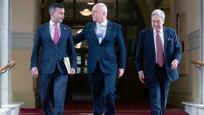 (L-R) David Seymour, leader of the ACT New Zealand party, New Zealand's incoming Prime Minister Christopher Luxon, and Winston Peters, leader of New Zealand First party, arrive for the signing of an agreement to form a three-party coalition government in November. Picture:/ AFP.