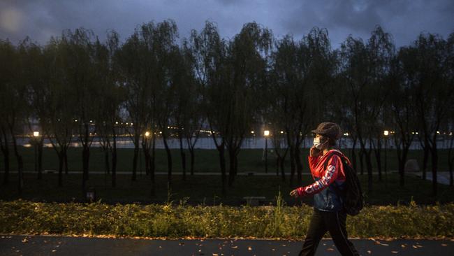 A resident walks in Jiangtan park after its reopening on March 26, 2020 in Wuhan. Picture: Getty