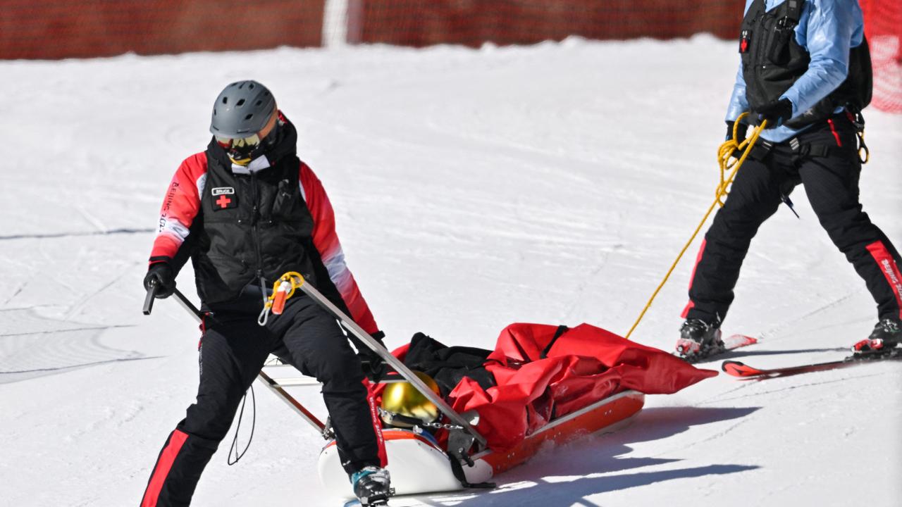 Germany's Dominik Schwaiger was stretchered off the course after crashing during his downhill final. Picture: Joe KLAMAR/AFP