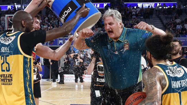 MELBOURNE, AUSTRALIA - MARCH 31: JackJumpers players celebrate with coach Scott Roth during game five of the NBL Championship Grand Final Series between Melbourne United and Tasmania JackJumpers at John Cain Arena, on March 31, 2024, in Melbourne, Australia. (Photo by Daniel Pockett/Getty Images)